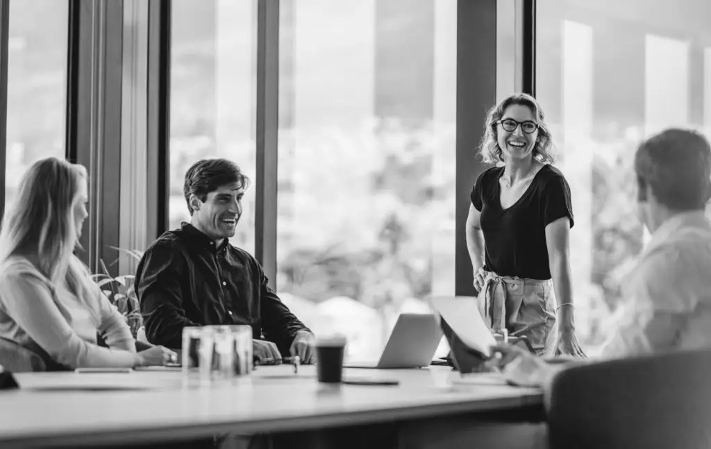 office-colleagues-having-casual-discussion-during-meeting-in-conference-room